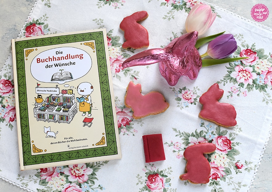 Osterhasen-Kekse, ein Schokoladenosterhase in pink Staniolpapier und Buch "Die Buchhandlung der Wünsche"